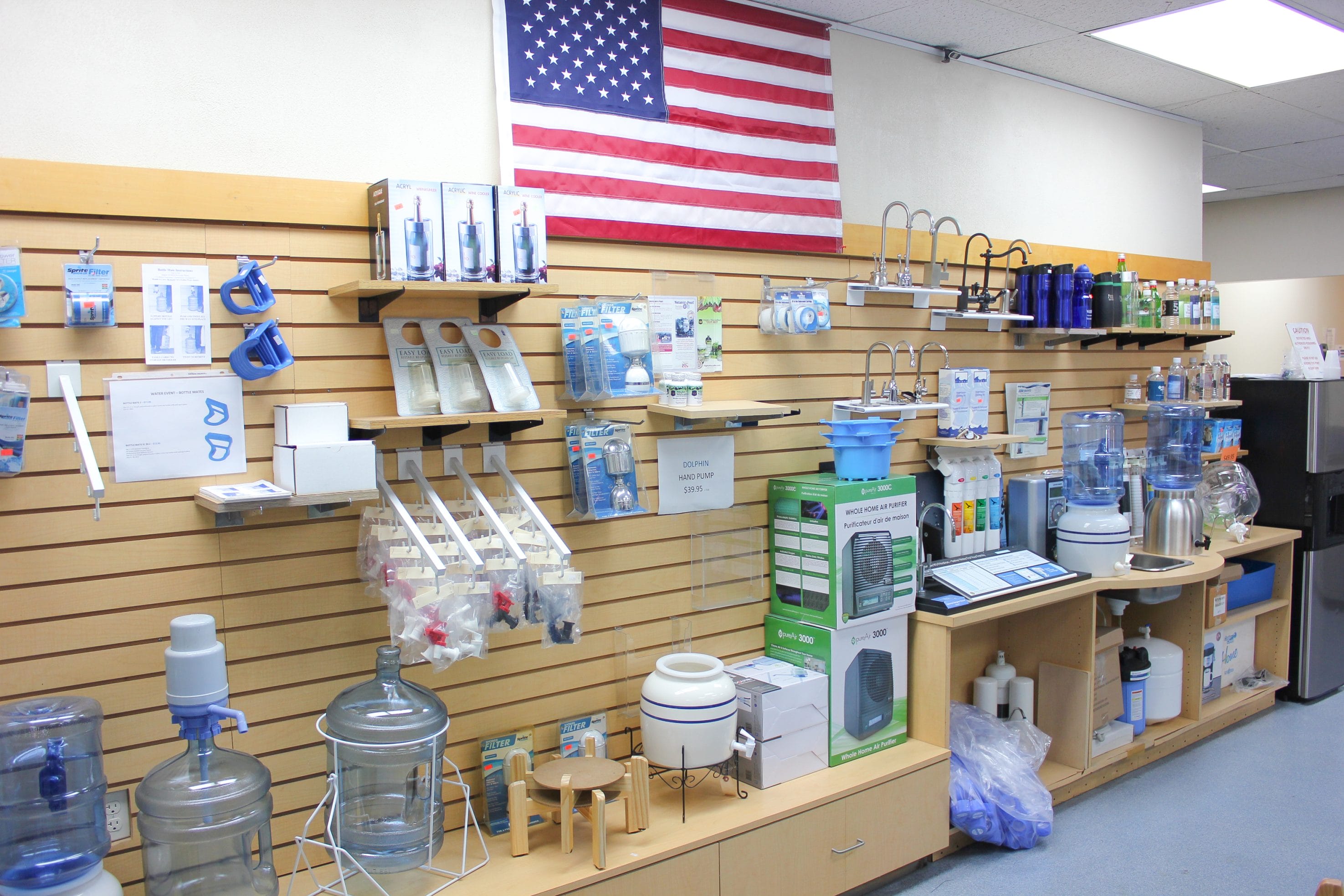 Texas Water House's Water Filtration Systems Showroom featuring an American flag display.