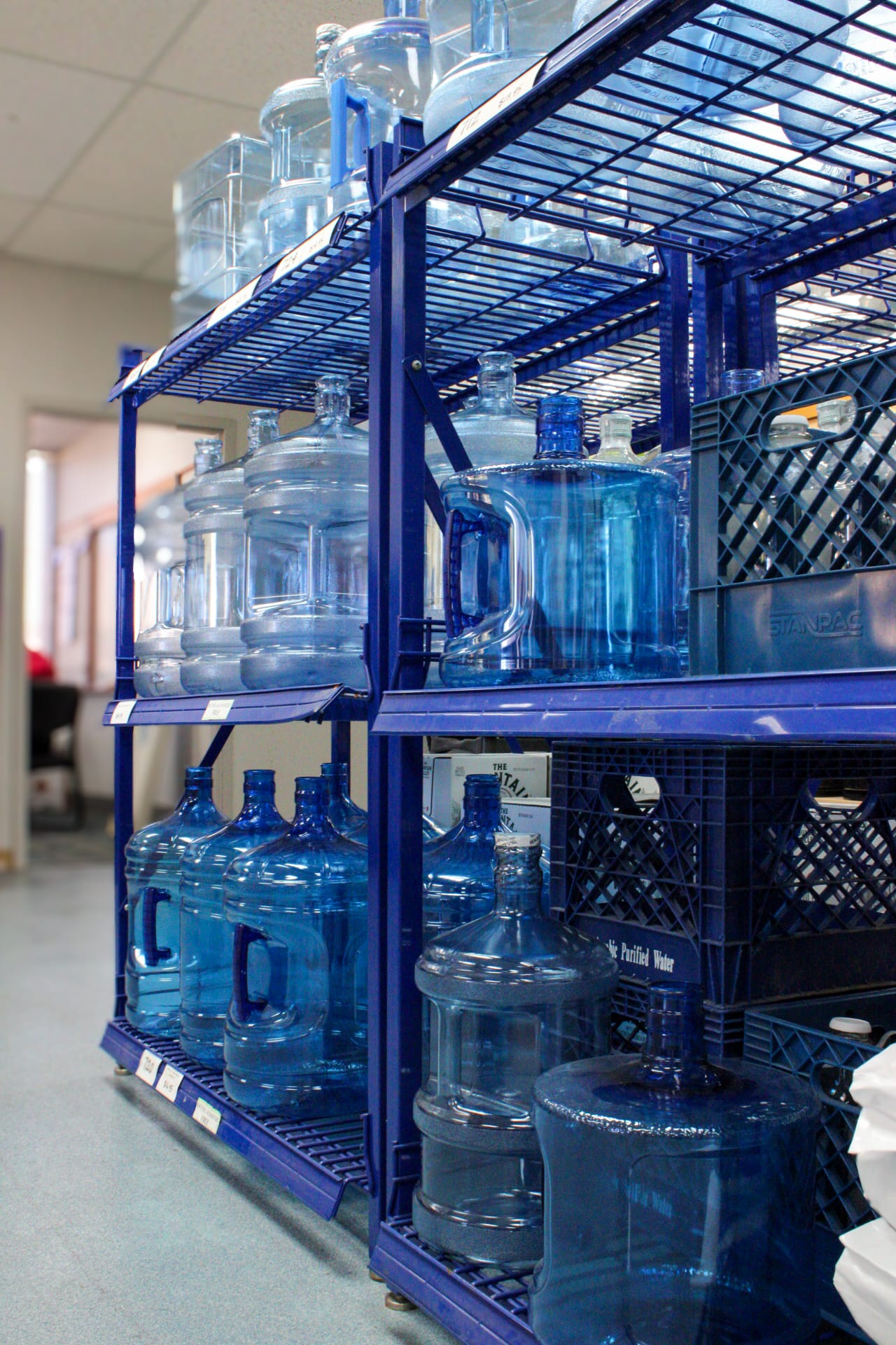 Rows of empty water jugs stored in Texas Water House's facility.