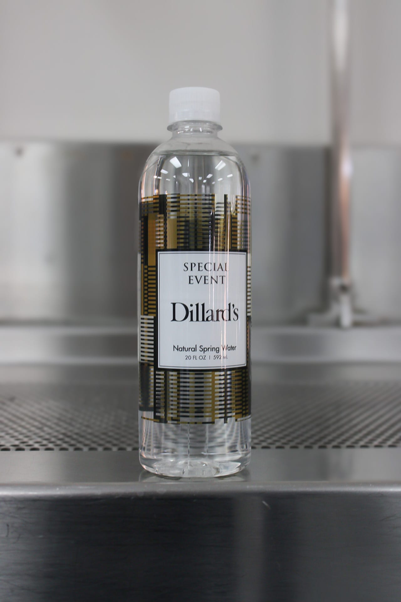 A customized water bottle with crystal clear water, created by Texas Water House.