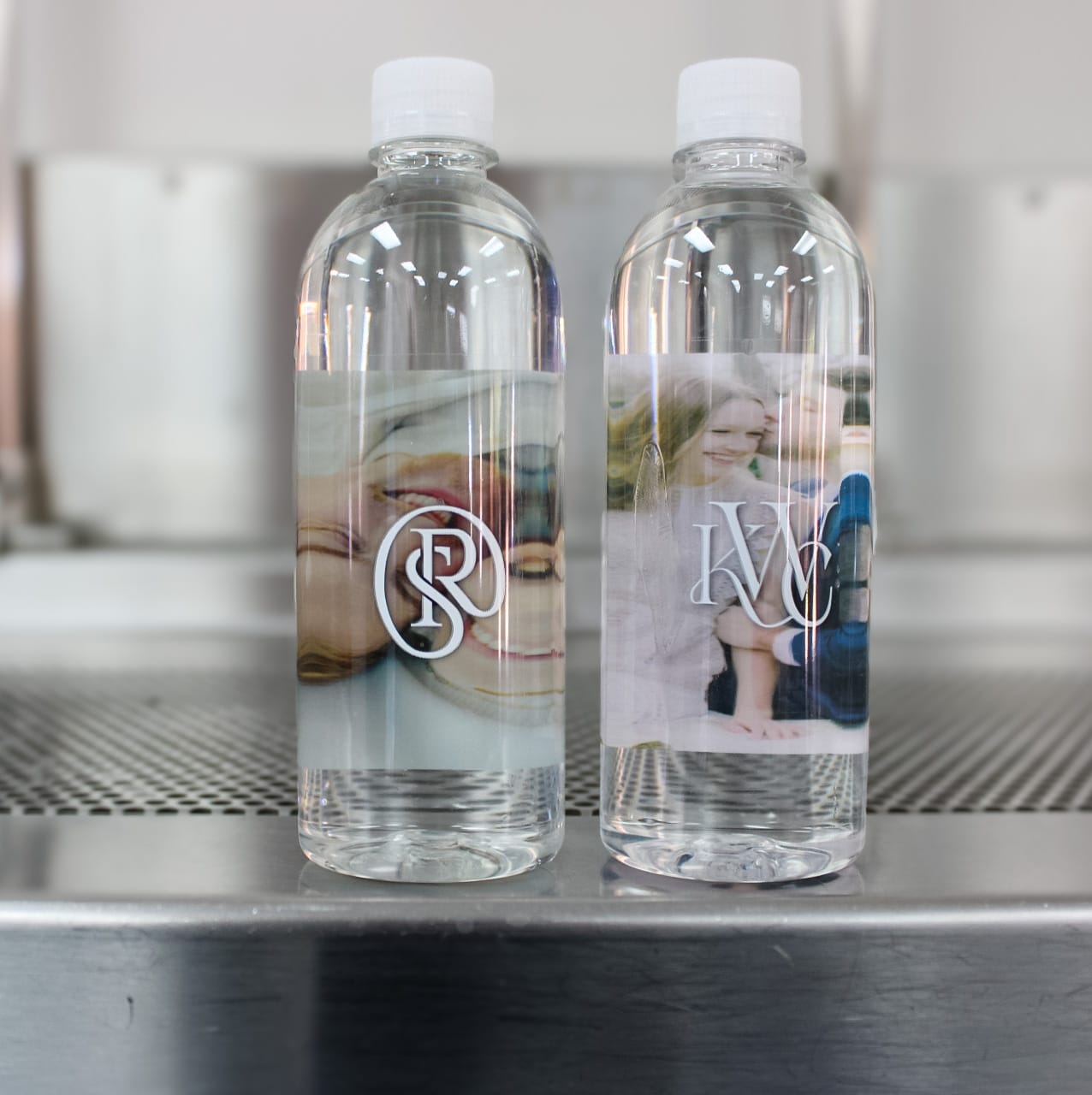 Two personalized bottles of water sitting next to eachother.