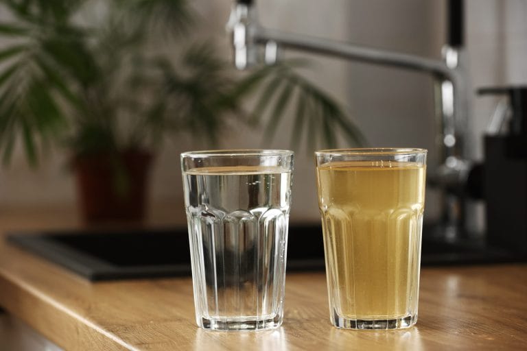 Adobe Stock image of a clear glass of water by a dirty glass of water.